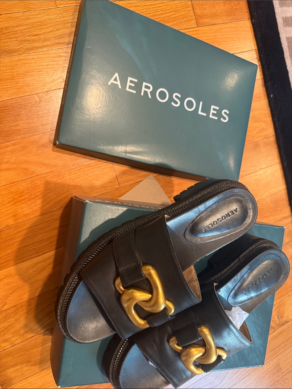 AEROSOLES Black Leather Slide Sandals with Gold Chain Detail